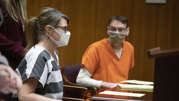 PONTIAC, MI - MARCH 22: Jennifer Crumbley and her husband James Crumbley, parents of the alleged teen Oxford High School shooter Ethan Crumbley who is charged with killing four people and wounding seven others, appear in 6th Circuit Court for their pretrial hearing on March 22, 2022 in Pontiac, Michigan. Both parents are being charged with four counts of involuntary manslaughter. It is the first time in the U.S. that the parents of an alleged mass school shooter have been charged in connection with their child's alleged school shooting. (Photo by Bill Pugliano/Getty Images)