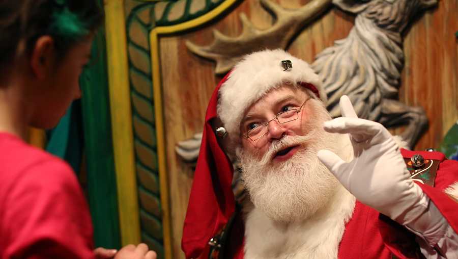 Santa Claus speaks to a young visitor at Macy's Santaland at the 34th Street store in New York.