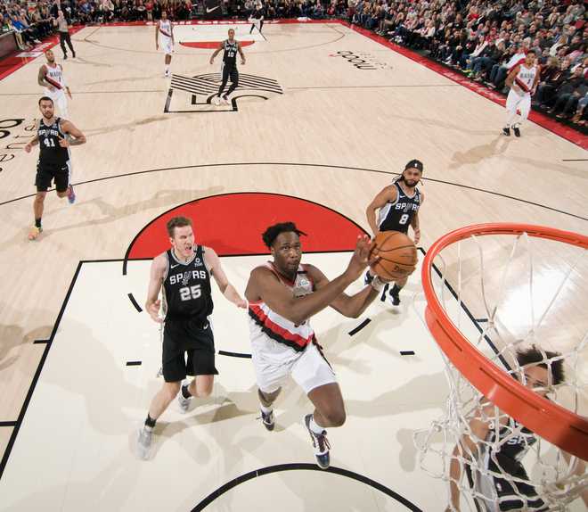 PORTLAND,&#x20;OR&#x20;-&#x20;FEBRUARY&#x20;6&#x3A;&#x20;Caleb&#x20;Swanigan&#x20;&#x23;50&#x20;of&#x20;the&#x20;Portland&#x20;Trail&#x20;Blazers&#x20;drives&#x20;to&#x20;the&#x20;basket&#x20;during&#x20;the&#x20;game&#x20;against&#x20;the&#x20;San&#x20;Antonio&#x20;Spurs&#x20;on&#x20;February&#x20;6,&#x20;2020&#x20;at&#x20;the&#x20;Moda&#x20;Center&#x20;Arena&#x20;in&#x20;Portland,&#x20;Oregon.&#x20;NOTE&#x20;TO&#x20;USER&#x3A;&#x20;User&#x20;expressly&#x20;acknowledges&#x20;and&#x20;agrees&#x20;that,&#x20;by&#x20;downloading&#x20;and&#x20;or&#x20;using&#x20;this&#x20;photograph,&#x20;user&#x20;is&#x20;consenting&#x20;to&#x20;the&#x20;terms&#x20;and&#x20;conditions&#x20;of&#x20;the&#x20;Getty&#x20;Images&#x20;License&#x20;Agreement.&#x20;Mandatory&#x20;Copyright&#x20;Notice&#x3A;&#x20;Copyright&#x20;2020&#x20;NBAE&#x20;&#x28;Photo&#x20;by&#x20;Cameron&#x20;Browne&#x2F;NBAE&#x20;via&#x20;Getty&#x20;Images&#x29;