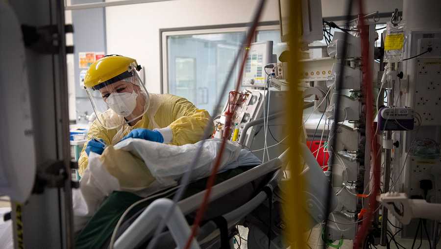 A UK study suggests COVID-19 infection grants immunity for five months. Seen here, a nurse works with a patient inside the Intensive Care Unit at St George's Hospital in London, on Jan. 6. (Victoria Jones/AP)