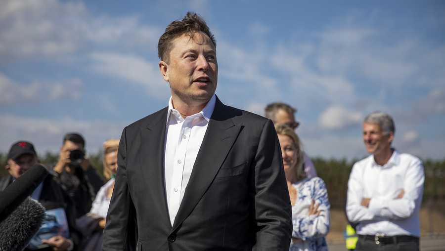 Tesla head Elon Musk talks to the press as he arrives to to have a look at the construction site of the new Tesla Gigafactory near Berlin on Sept. 3, 2020 near Gruenheide, Germany.