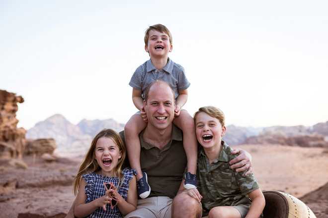 The Duke and Duchess of Cambridge release a handout photo to celebrate Father's Day 2022 A handout photo of Britain Prince William with Princess Charlotte, Prince Louis and Prince George in Jordan in the autumn of 2021. . Duke and Duchess of Cambridge, Kensington, Palace, Handout, via, REUTERS, THIS IMAGE HAS x20;WAS SUPPLIED BY THIRD PARTY. MANDATORY CREDIT. NO RESALE. NO x20;ARCHIVES. NO COMMERCIAL OR BOOK SALES. NOT FOR USE AFTER DECEMBER 31, 2022 WITHOUT PRIOR APPROVAL FROM KENSINGTON PALACE. NEWS EDITORIAL USE ONLY. NO COMMERCIAL USE. NO MERCHANDISING, ADVERTISING, SOUVENIRS, MEMORABILIA or COLORABLE x20;Similar. The photo is intended solely for editorial use only. souvenirs, or memorabilia; or anything colored like that. No charge should x20;made for the delivery, publication or publication of the photo. There may be no commercial use whatsoever of the photograph (including by way x20;by example only) any use in merchandising, advertising or other x20;non-"news"editorial "use" x20;tampered with or modified in manner or form and must include all of the individuals in the photograph when published.
