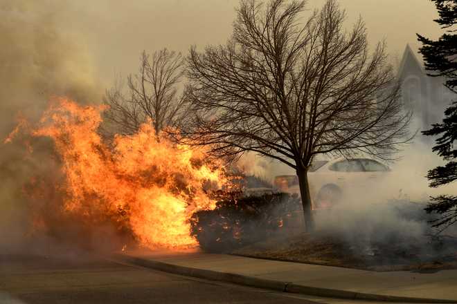 Fire&#x20;burns&#x20;in&#x20;bushes&#x20;near&#x20;a&#x20;La&#x20;Quinta&#x20;hotel&#x20;on&#x20;Dec.&#x20;30,&#x20;2021&#x20;in&#x20;Louisville,&#x20;Colorado.&#x20;Fierce&#x20;winds&#x20;have&#x20;whipped&#x20;wildfires&#x20;in&#x20;Boulder&#x20;County.&#x20;The&#x20;towns&#x20;of&#x20;Superior&#x20;and&#x20;Louisville&#x20;have&#x20;been&#x20;evacuated.&#x20;Multiple&#x20;homes&#x20;and&#x20;businesses&#x20;have&#x20;burned&#x20;from&#x20;the&#x20;fast&#x20;moving&#x20;fire&#x20;stocked&#x20;by&#x20;fierce&#x20;winds,&#x20;with&#x20;gusts&#x20;topping&#x20;100&#x20;mph,&#x20;along&#x20;the&#x20;foothills.&#x20;The&#x20;fire&#x20;has&#x20;officially&#x20;been&#x20;named&#x20;the&#x20;Marshall&#x20;Fire.&#x20;&#x28;Photo&#x20;by&#x20;Helen&#x20;H.&#x20;Richardson&#x2F;MediaNews&#x20;Group&#x2F;The&#x20;Denver&#x20;Post&#x20;via&#x20;Getty&#x20;Images&#x29;