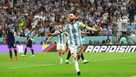 Lionel Messi celebrates after scoring Argentina's first goal from the penalty spot.