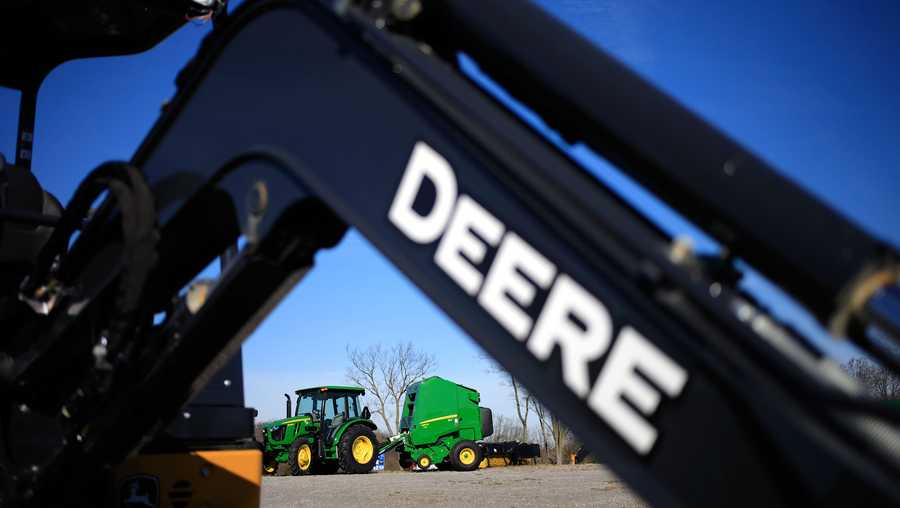 A Deere & Co. tractor and round baler for sale at a John Deere dealership in Shelbyville, Kentucky, U.S., on Thursday, Nov. 19, 2020. (Luke Sharrett/Bloomberg via Getty Images)