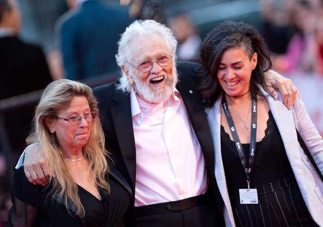 Wanda Hawkins, musician Ronnie Hawkins and guest arrive for Inauguration N Festive presentation"Once Were Brothers: Robbie Robertson and The Band x20; during his time in Toronto, Ontario, Canada.