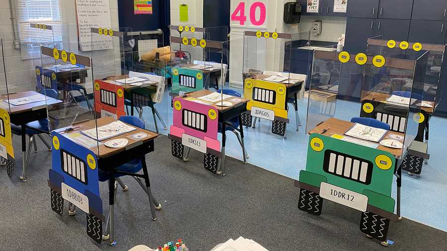 The teachers at St. Barnabas Episcopal School spent a week redesigning the desks, which feature construction paper tires, headlights and license plates.