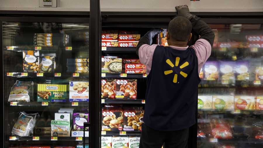 An employee restocks frozen food products at a Walmart Inc. store in Burbank, California, U.S., on Tuesday, Nov. 26, 2019. A PWC survey shows that 36% of consumers surveyed plan to shop on Black Friday. Deals will ultimately dictate where spending and visits go.