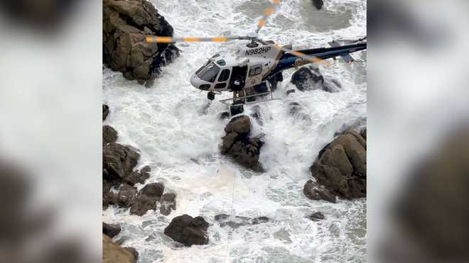 This&#x20;image&#x20;from&#x20;video&#x20;provided&#x20;by&#x20;San&#x20;Mateo&#x20;County&#x20;Sheriff&#x27;s&#x20;Office&#x20;shows&#x20;a&#x20;helicopter&#x20;rescue&#x20;after&#x20;a&#x20;Tesla&#x20;plunged&#x20;off&#x20;a&#x20;Northern&#x20;California&#x20;cliff&#x20;along&#x20;the&#x20;Pacific&#x20;Coast&#x20;Highway,&#x20;Monday,&#x20;Jan.&#x20;2,&#x20;2023,&#x20;near&#x20;an&#x20;area&#x20;known&#x20;as&#x20;Devil&#x27;s&#x20;Slide,&#x20;leaving&#x20;four&#x20;people&#x20;in&#x20;critical&#x20;condition,&#x20;a&#x20;fire&#x20;official&#x20;said.&#x20;&#x28;San&#x20;Mateo&#x20;County&#x20;Sheriff&#x27;s&#x20;Office&#x20;via&#x20;AP&#x29;