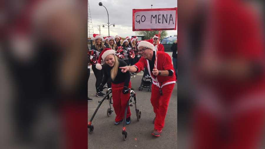 17-year-old Mena Hawkins with cerebral palsy walked across the finish line at the Las Vegas Great Santa Run.