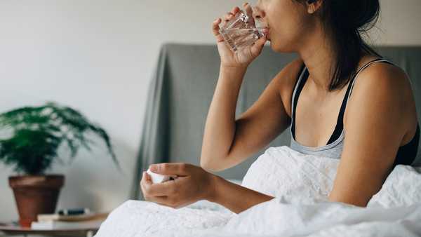 woman taking medicine