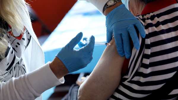 A healthcare worker administers the vaccine at the Empire State Building. (Photo by Monica Schipper/Getty Images for Empire State Realty Trust, Inc.)