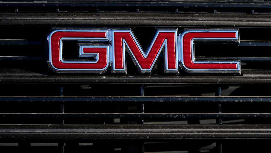 FILE - A GMC company logo is displayed at a GMC Truck dealership Sunday, Feb. 7, 2021, in Castle Rock, Colo. General Motors is recalling nearly 682,000 small SUVs, Friday, April 1, 2022, because the windshield wipers can fail.The recall covers the Chevrolet Equinox and GMC Terrain from the 2014 and 2015 model years