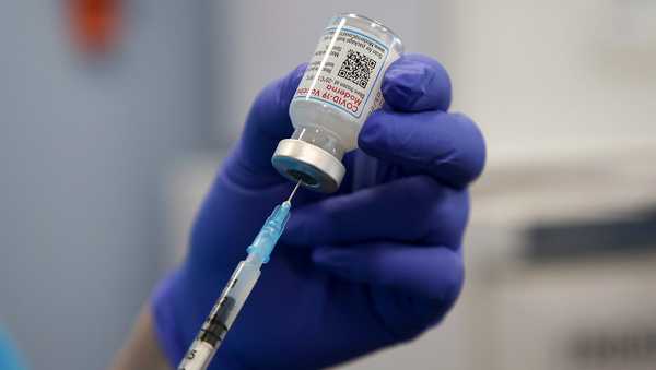 A health worker draws the Moderna COVID-19 vaccine as she prepares to administer the spring booster also known as fourth jab to a person at a vaccination clinic. (Photo by Dinendra Haria / SOPA Images/Sipa USA)(Sipa via AP Images)