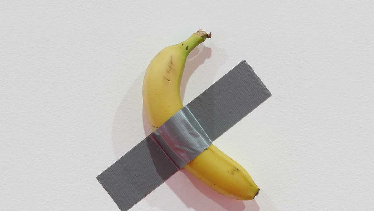 Student eats artwork of a banana ducttaped to a museum wall because