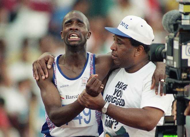 Jim Redmond, who helped his son Derek to the finish line in 1992 ...