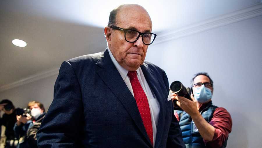Rudy Giuliani, seen here at a news conference at the Republican National Committee on Nov. 19, 2020, left the hospital Wednesday after spending four days there battling the deadly coronavirus.