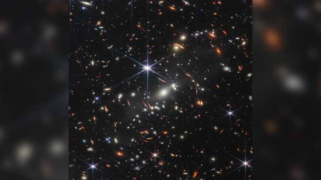 The James Webb Space Telescope's first deep field was shared on x20; July 11 The image shows SMACS 0723, where a massive group of galaxy clusters act as a magnifying glass for the objects behind them, including faint, distant galaxies.