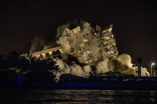 The rest of the Champlain South tower is seen being demolished in Surfside, Florida, north of Miami Beach, late on July 4.