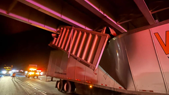 Driver charged after suspended dump truck bed strikes overpass on I-77 ...