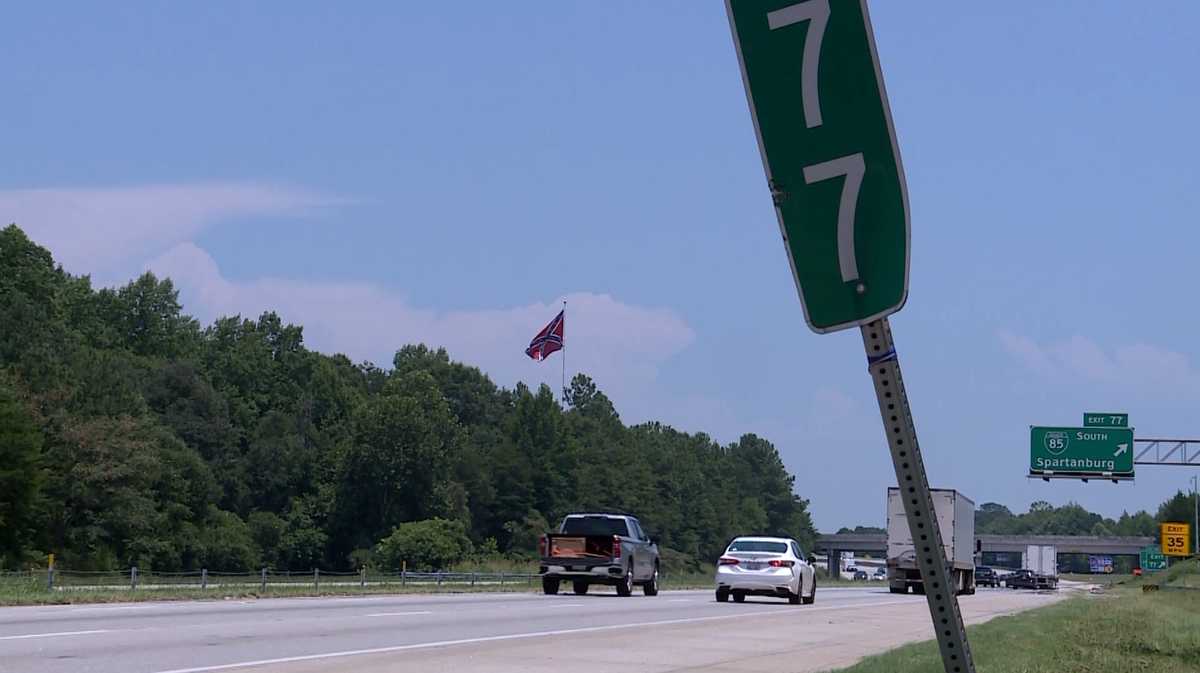 Confederate flagpole near I-85 lowered after court order