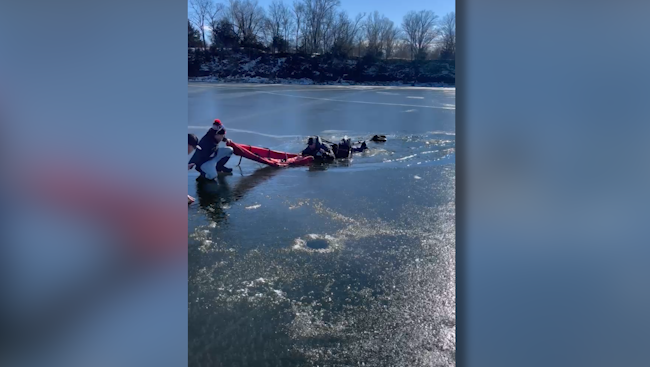 The group jumps into action to rescue a fisherman who fell through the ice on Sunday