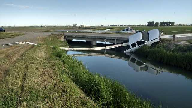 This Sunday, June 4, 2017 photo shows where a stolen pickup truck was found impaled on about 30 feet of guard rail over a canal near Aberdeen in eastern Idaho.