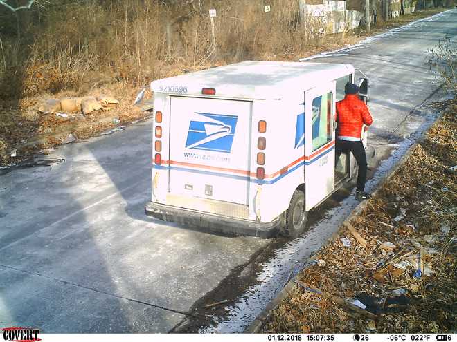 KC's illegal dumping cams catch what looks like USPS worker tossing mail