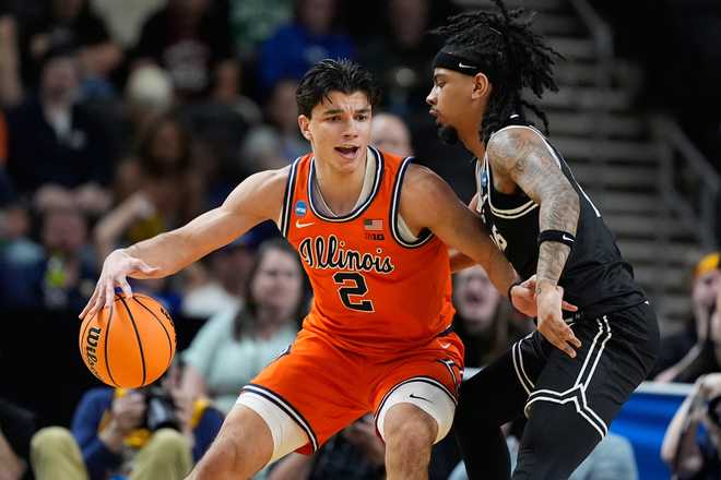 Illinois guard Andrej Stojakovic (2) dribbles against Virginia Commonwealth guard Terrence Hill Jr. (6) during the first half in the second round of the NCAA college basketball tournament, Saturday, March 21, 2026.