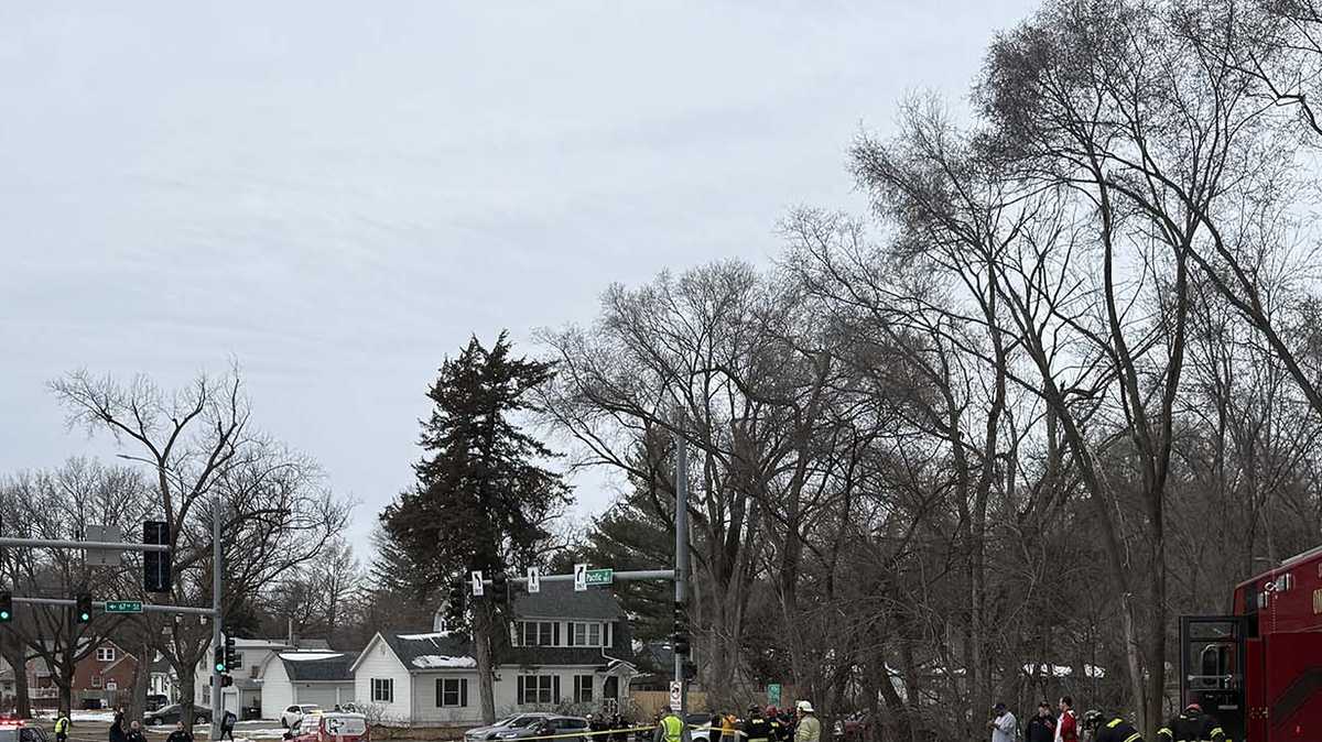 Two vehicles stuck in sinkhole on Pacific Street after road 'collapsed,' Omaha police say