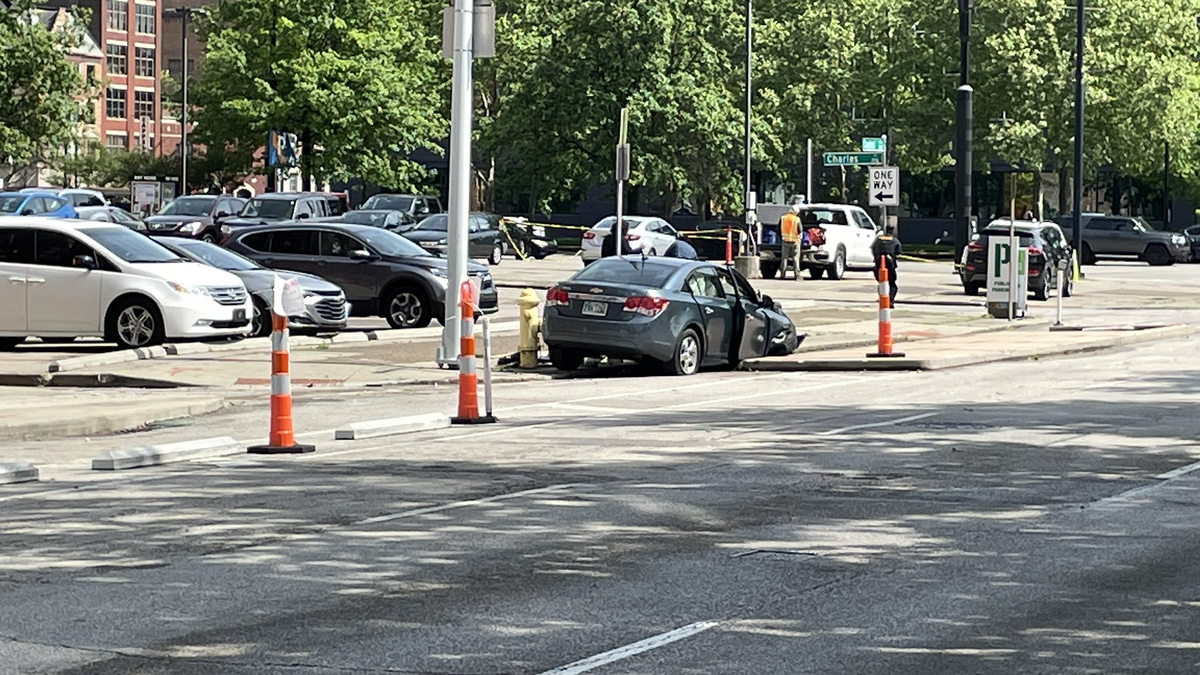 Police: 1 dead after car strikes building in the West End