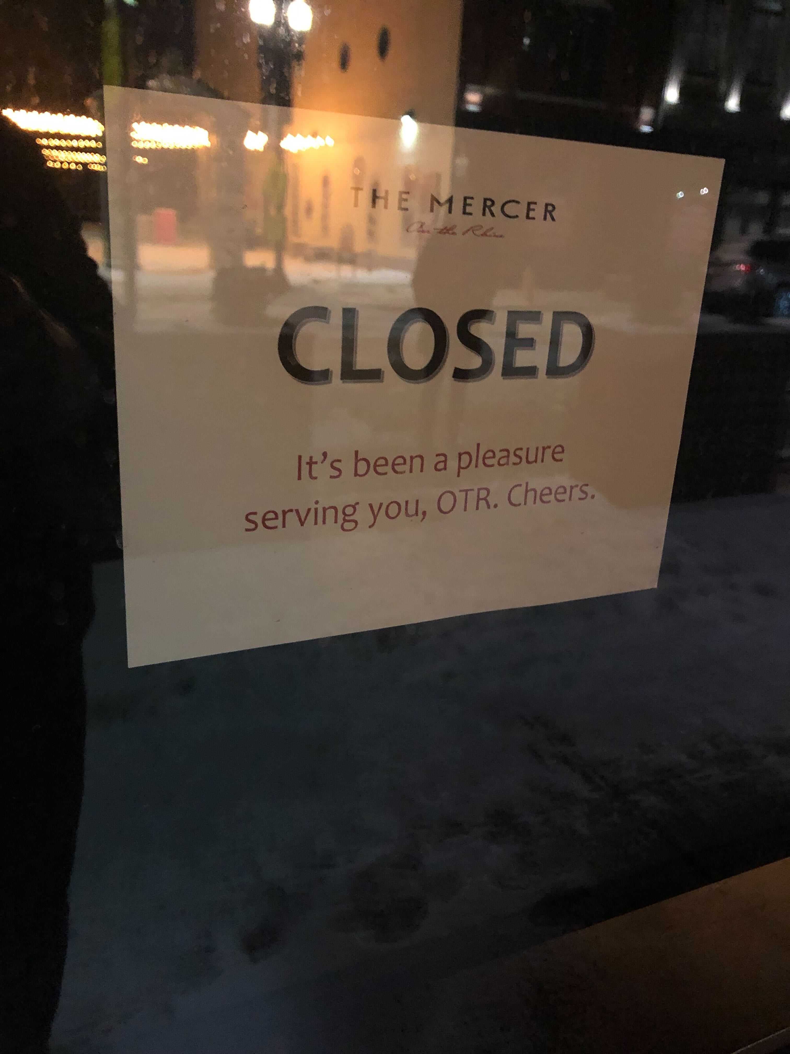 The Mercer OTR hangs closed signs on restaurant door