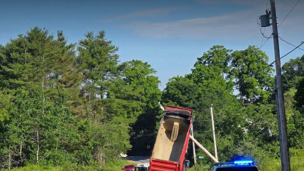 Cumberland road closed after dump truck pulls down power pole