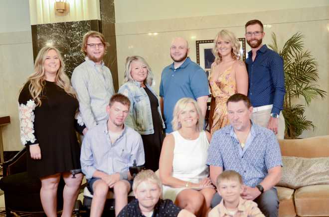 Colin Gourley alongside his family.