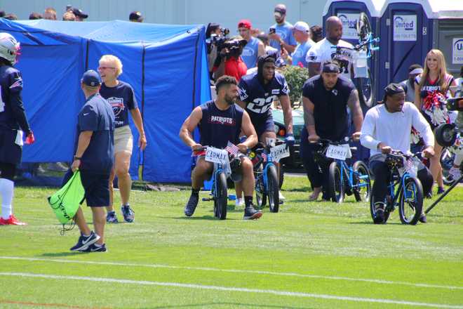 Pats surprise children of Military service members with new bikes