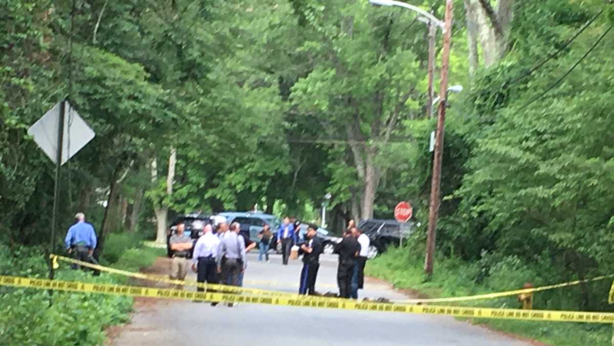 Police patrol finds body dumped, burned on side of road