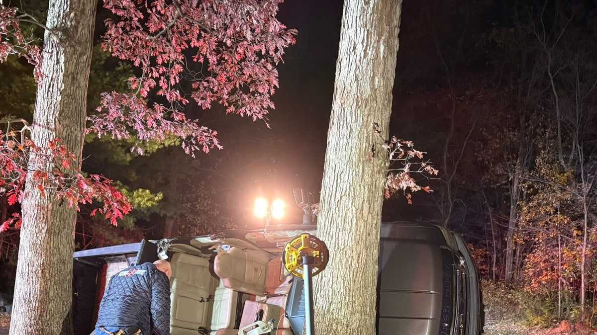 Crews cut roof off truck to free trapped driver before helicopter ...
