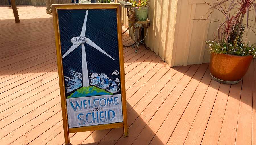 chalk art at scheid's winery in greenfield depicts the vineyard's signature wind turbine.