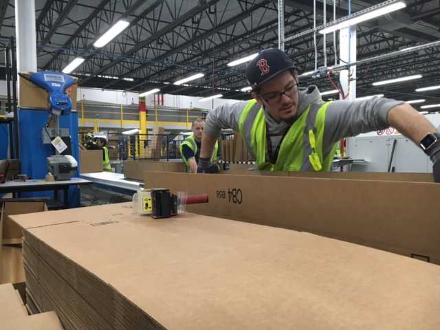 Amazon shows off massive, new warehouse on South Coast