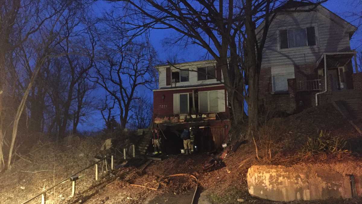 Police officer carries man to safety following fire at Lincoln