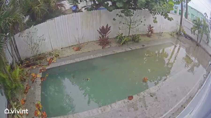 Flood waters cover pool at home along Pearl St. on Fort Myers Beach