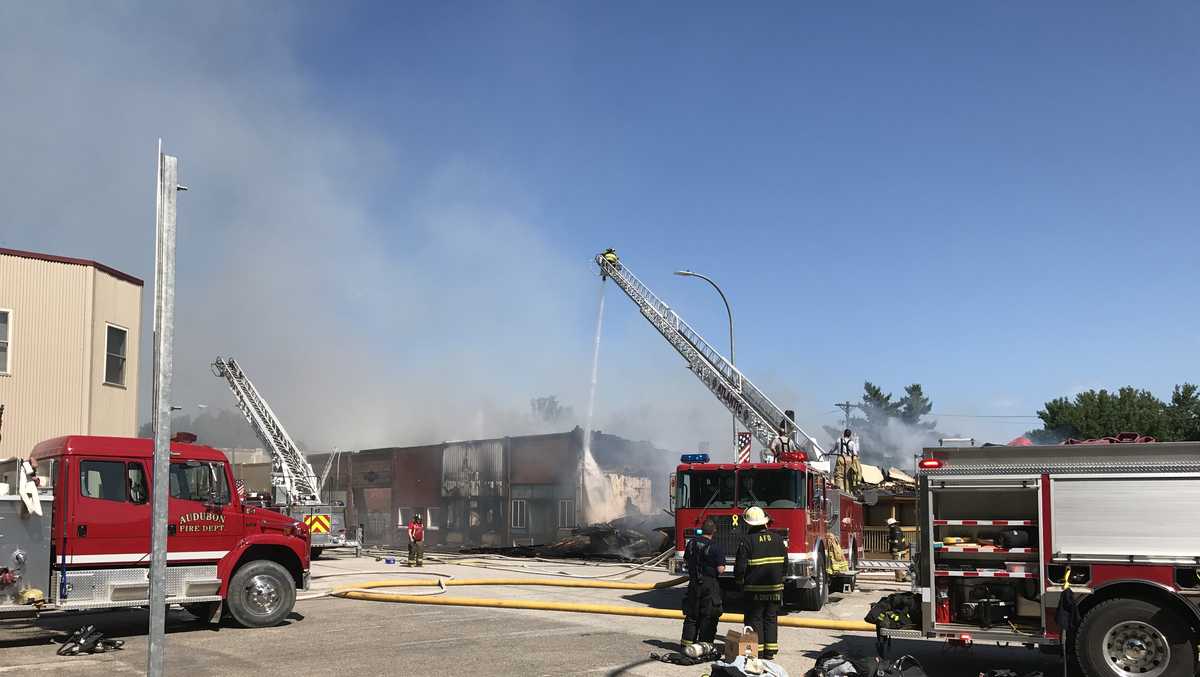 Multiple fire departments battle large building fire in Exira