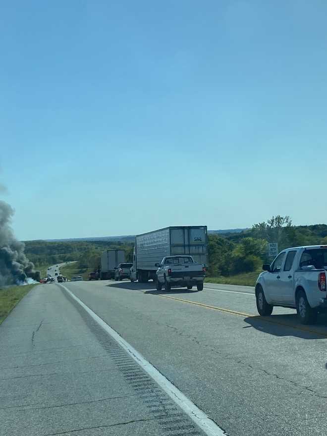 Photos show a plume of smoke and a long line of cars waiting on 169 Highway in Miami County, Kansas.