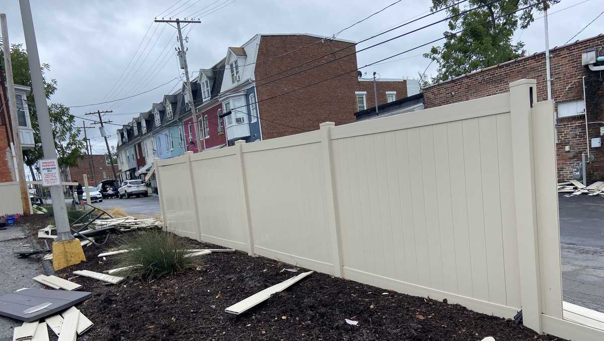 PHOTOS: Vehicle crashes through fence, snaps pole in York County, Pa.