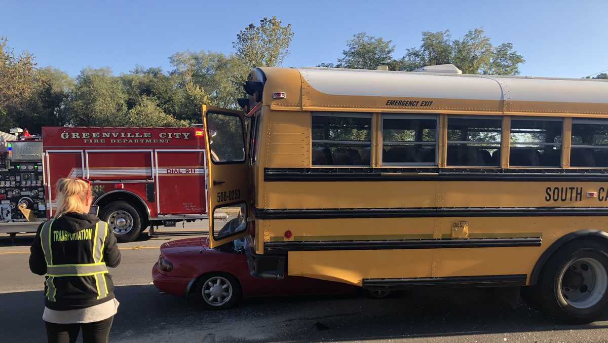 Sports car crashes into school bus at bus stop; 60 students on board