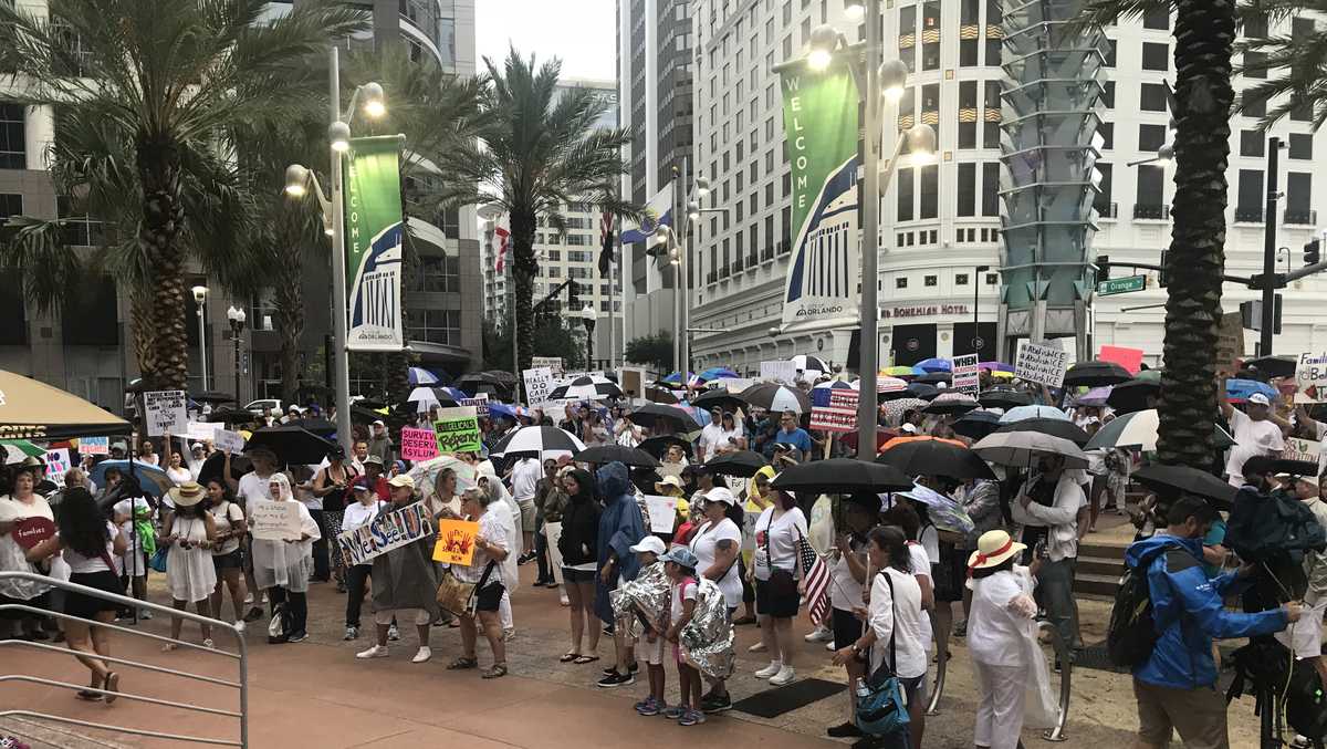 Protesters gather outside of Orlando City Hall for 'Families Belong