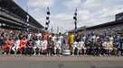 The drivers in the field for the 101st running of the Indianapolis 500 auto race pose on the start/finish line before the start of the race at Indianapolis Motor Speedway, Sunday, May 28, 2017 in Indianapolis. (AP Photo/Michael Conroy)