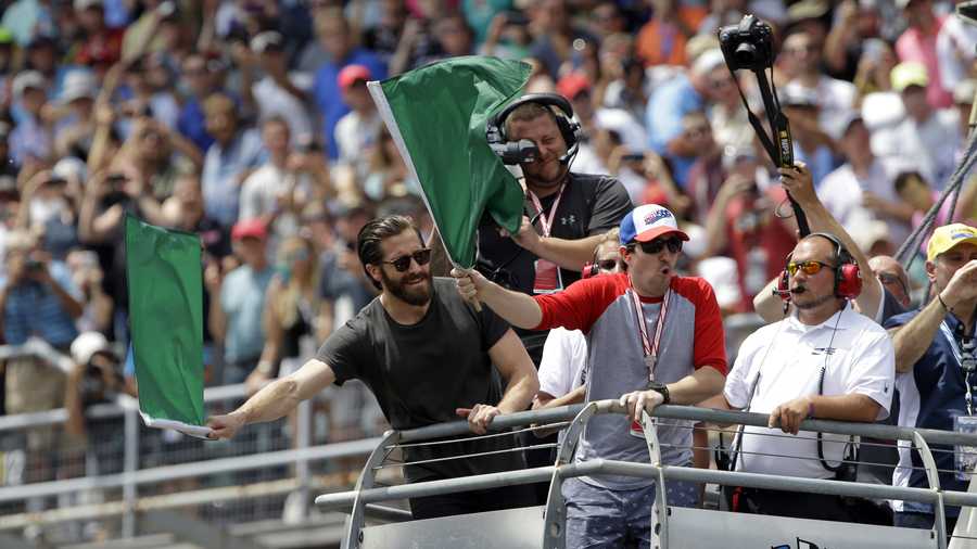 Actor Jake Gyllenhaal and Boston bombing survivor Jeff Bauman, left, wave the green flags to start the 101st running of the Indianapolis 500 auto race at Indianapolis Motor Speedway, Sunday, May 28, 2017 in Indianapolis. (AP Photo/Michael Conroy) Actor Jake Gyllenhaal and Boston bombing survivor Jeff Bauman, left, wave the green flags to start the 101st running of the Indianapolis 500 auto race at Indianapolis Motor Speedway, Sunday, May 28, 2017 in Indianapolis. (AP Photo/Michael Conroy)