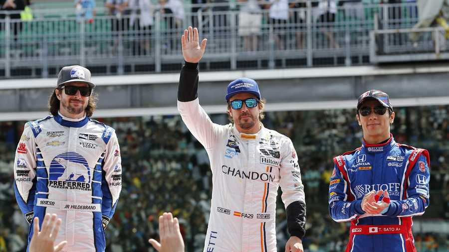 Fernando Alonso, of Spain, enter, Takuma Sato, of Japan, right and JR Hildebrand are introduced before the Indianapolis 500 auto race at Indianapolis Motor Speedway, Sunday, May 28, 2017 in Indianapolis. (AP Photo/Sam Riche) Fernando Alonso, of Spain, enter, Takuma Sato, of Japan, right and JR Hildebrand are introduced before the Indianapolis 500 auto race at Indianapolis Motor Speedway, Sunday, May 28, 2017 in Indianapolis. (AP Photo/Sam Riche)