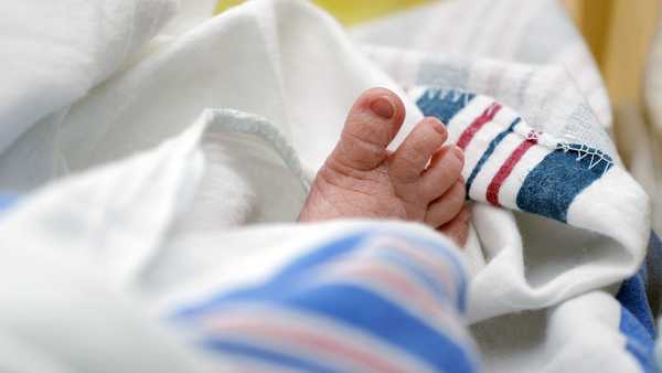 FILE - The toes of a baby peek out of a blanket at a hospital in McAllen, Texas. On Wednesday, Nov. 1, 2023, the Centers for Disease Control and Prevention reported the increase of U.S. infant mortality rate to 3% in 2022; a rare increase in a death statistic that has been generally been falling for decades. (AP Photo/Eric Gay, File)